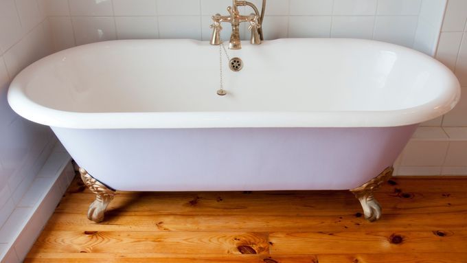 A clawfoot bathtub refinished to no longer look worn out.