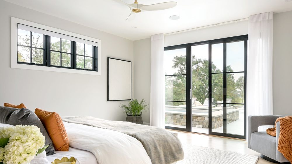 Guest bedroom with white ceiling fan