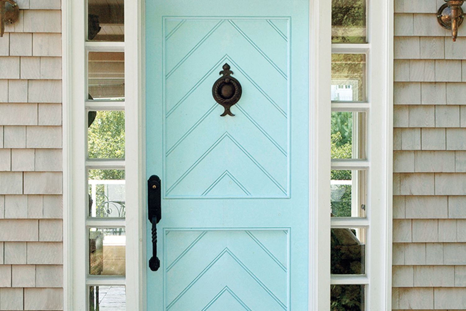 A light blue door in the entryway of a home.