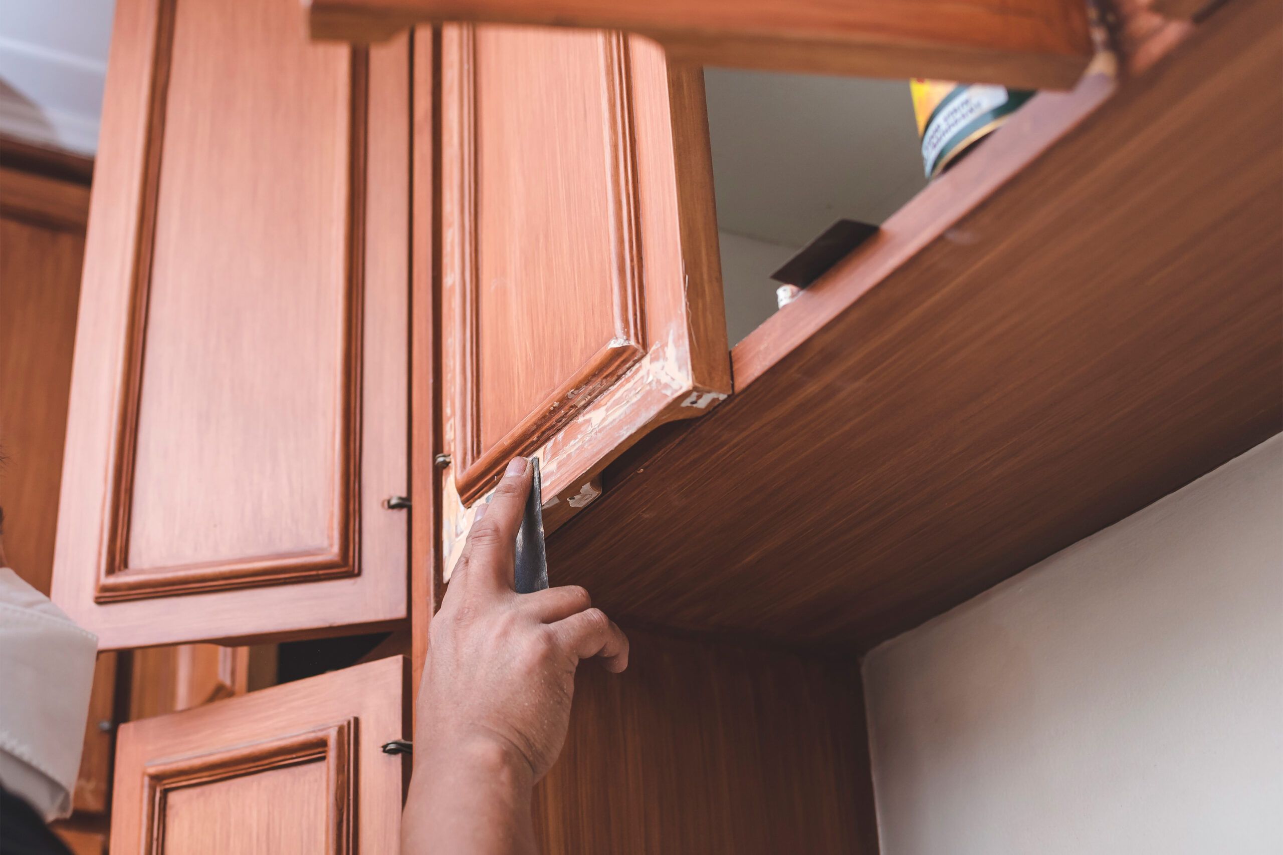 Prepping a wood kitchen cabinet for laminating