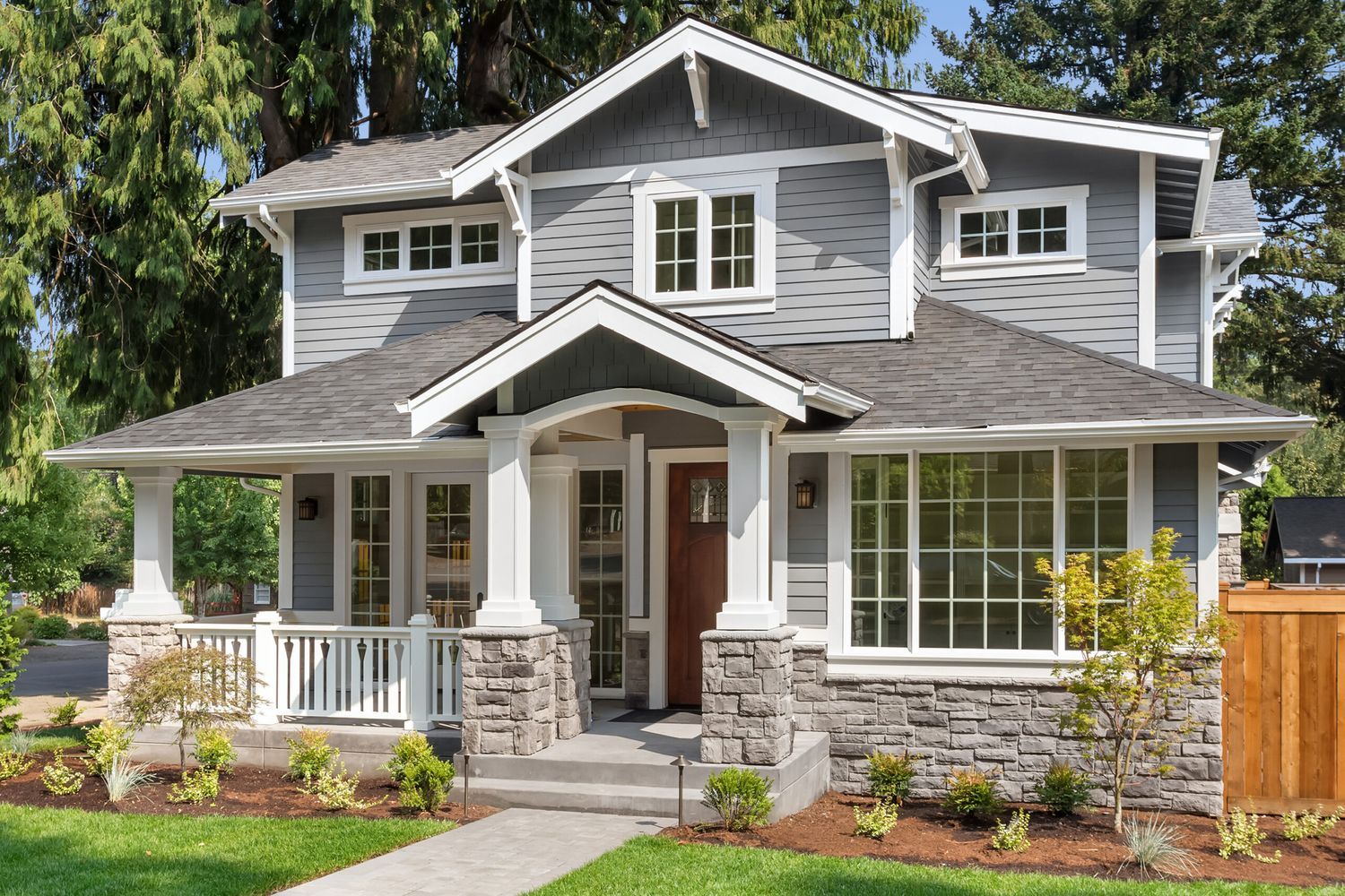 A house with a coat of grey exterior paint.