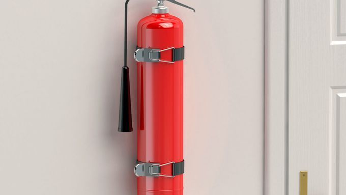 A fire extinguisher hanging on a wall.