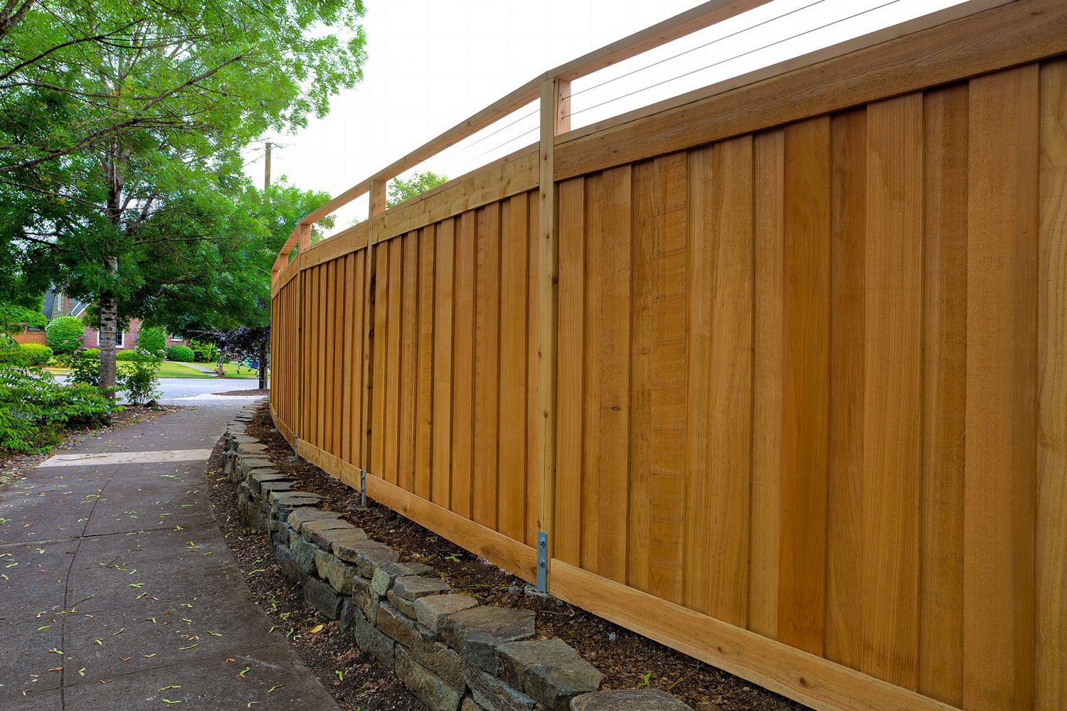 A noise reducing fence at the edge of a yard.