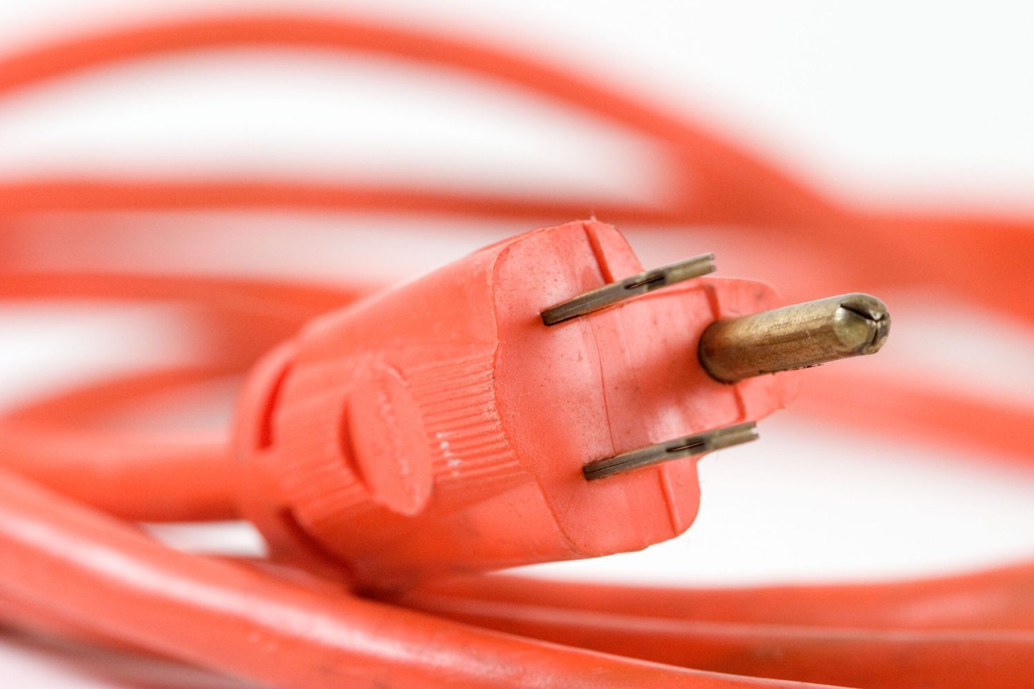 Red extension cord with a replaced plug end.