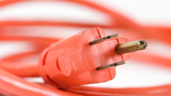 Red extension cord with a replaced plug end.