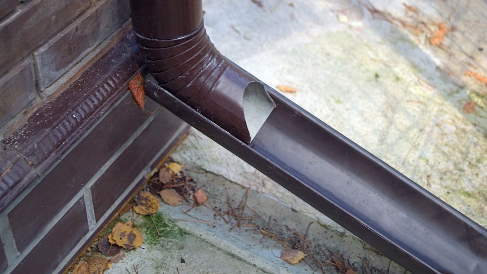 Image of a gutter downspout with an extension added. iStock_1205986956