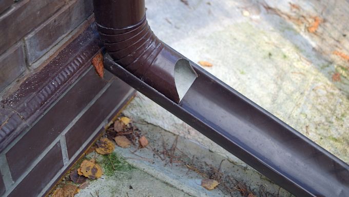 Image of a gutter downspout with an extension added. iStock_1205986956