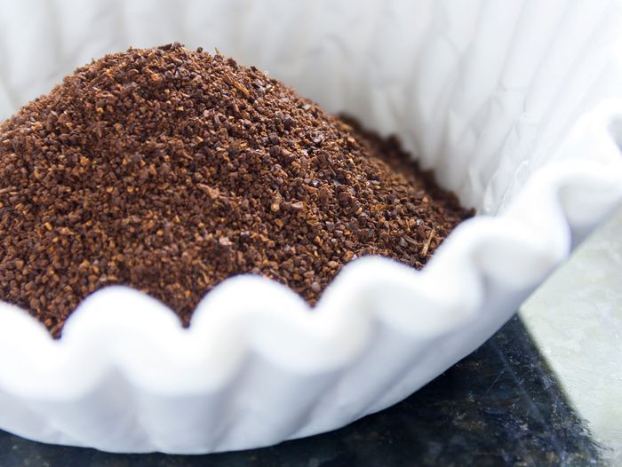 Coffee filters full of coffee grounds.