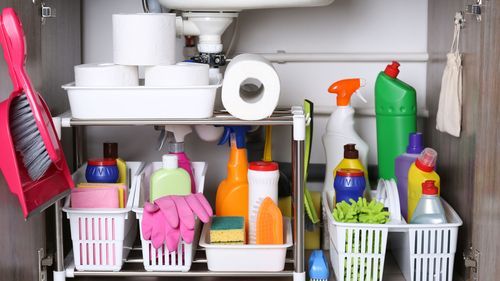 View under a sink with many household products