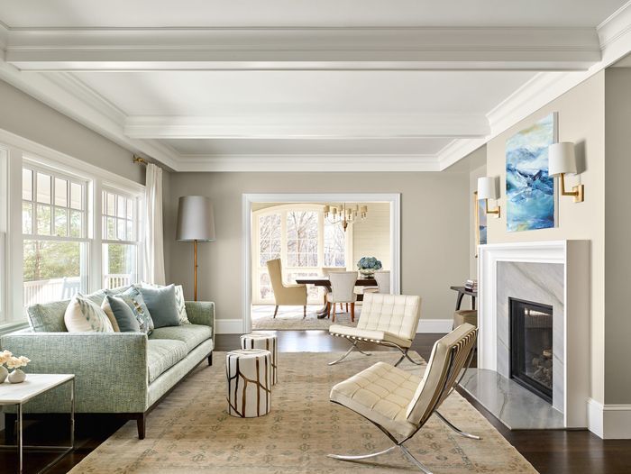 Living room with fireplace and coffered ceilings