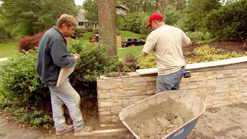 S8 E10, Roger Cook dresses up a concrete retaining wall with stone veneer