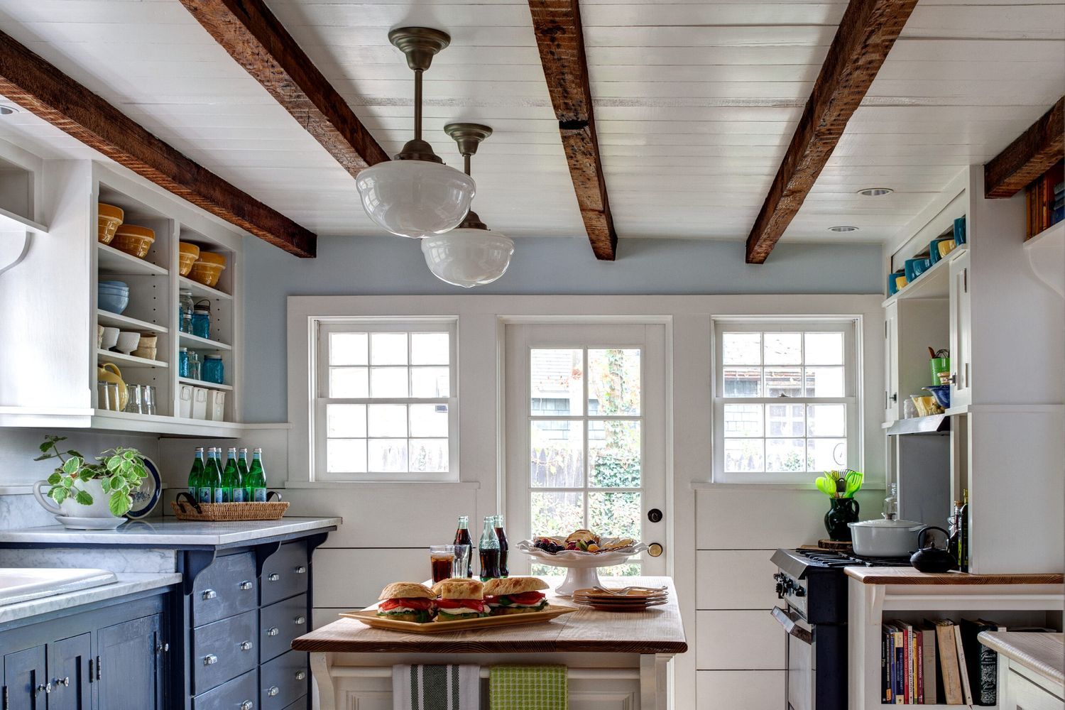 A room with faux wood beams on the ceiling.