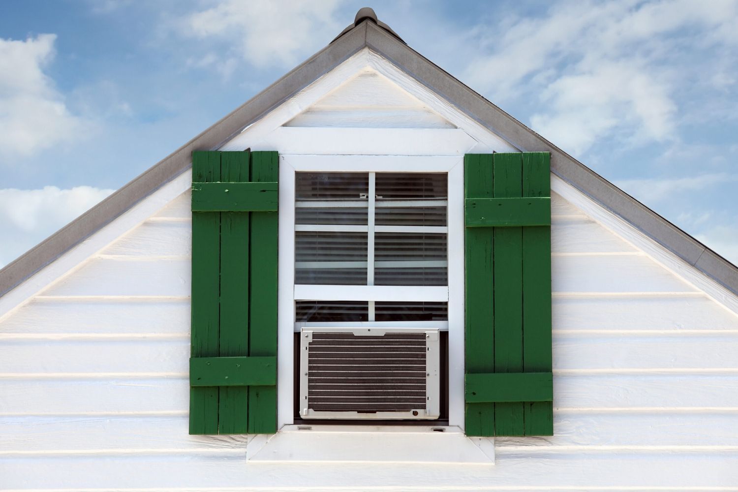 House with a clean window AC unit installed.