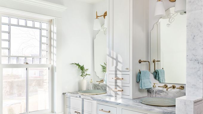 All white bathroom with gold fixtures