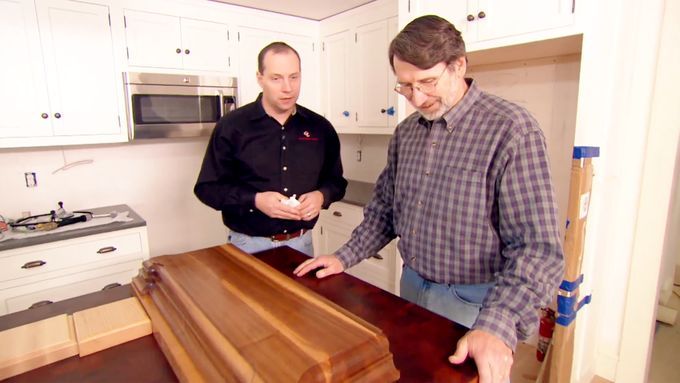 Norm Abram looks at the butcher-block countertop at the Newton Centre House