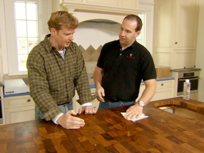 Kevin O'Connor looks at the teak island countertop at the Newton Centre House