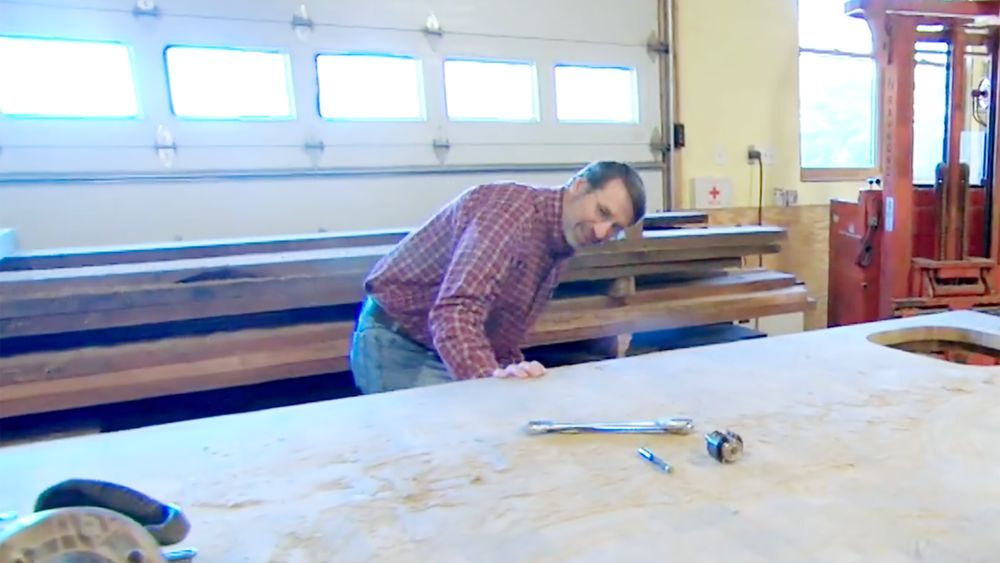 Norm Abram visits the factory where the teak countertops are being made for the Newton Shingle House