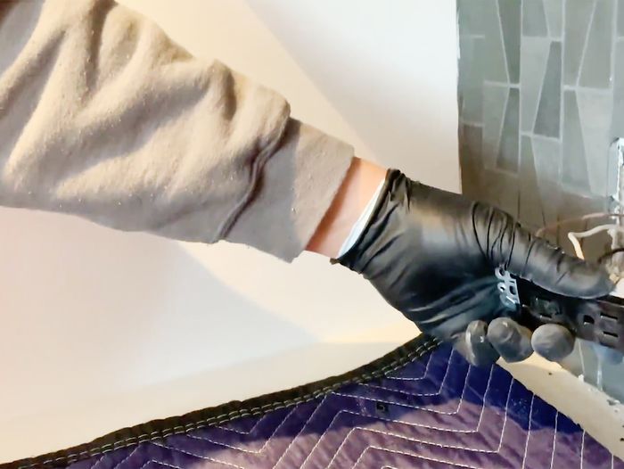 Heath Eastman installs an outlet at the Brookline House