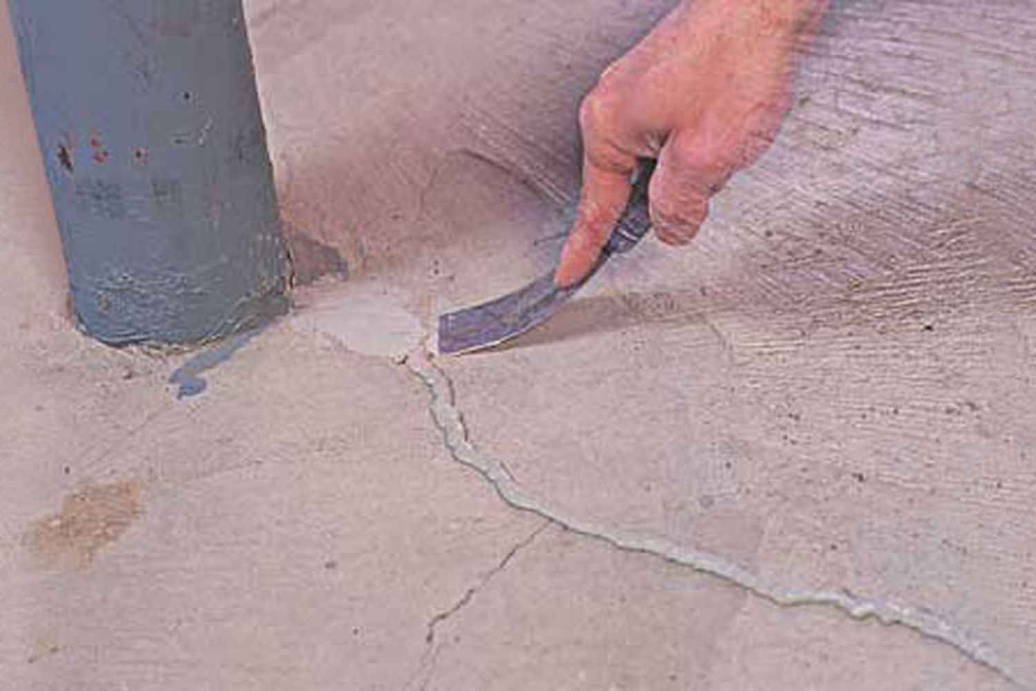 Cracked concrete is being repaired.