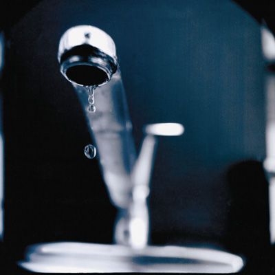 A leaky faucet, which is a common kitchen plumbing problem.