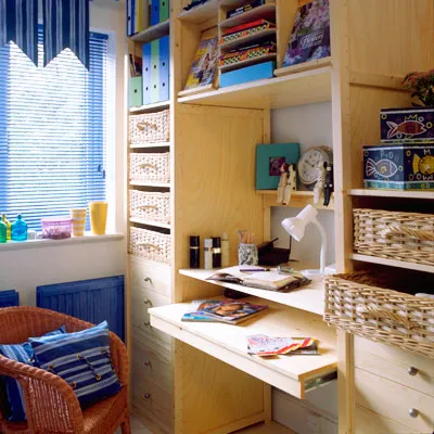 Homework alcove built into a storage cabinet to save space. 