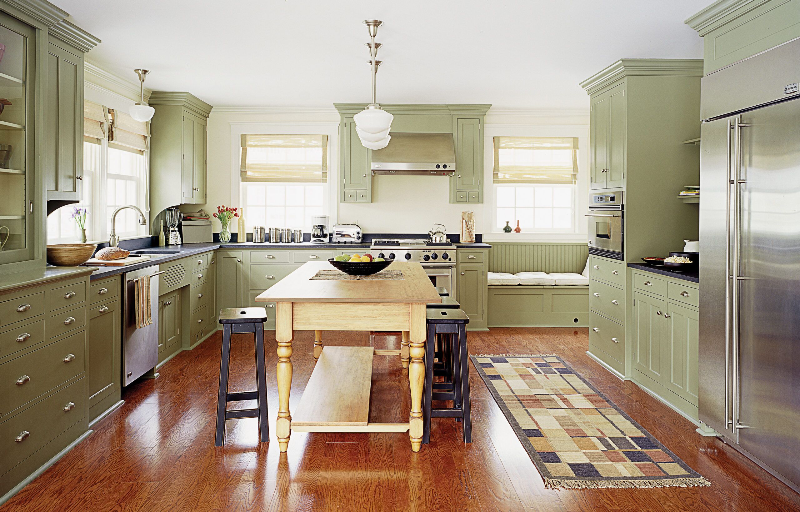 Mahogany stain on this engineered red oak floor from Harris Wood warms up the kitchen of a Winchester, Mass., home remodeled by TOH TV.