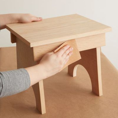 sanding a wood table