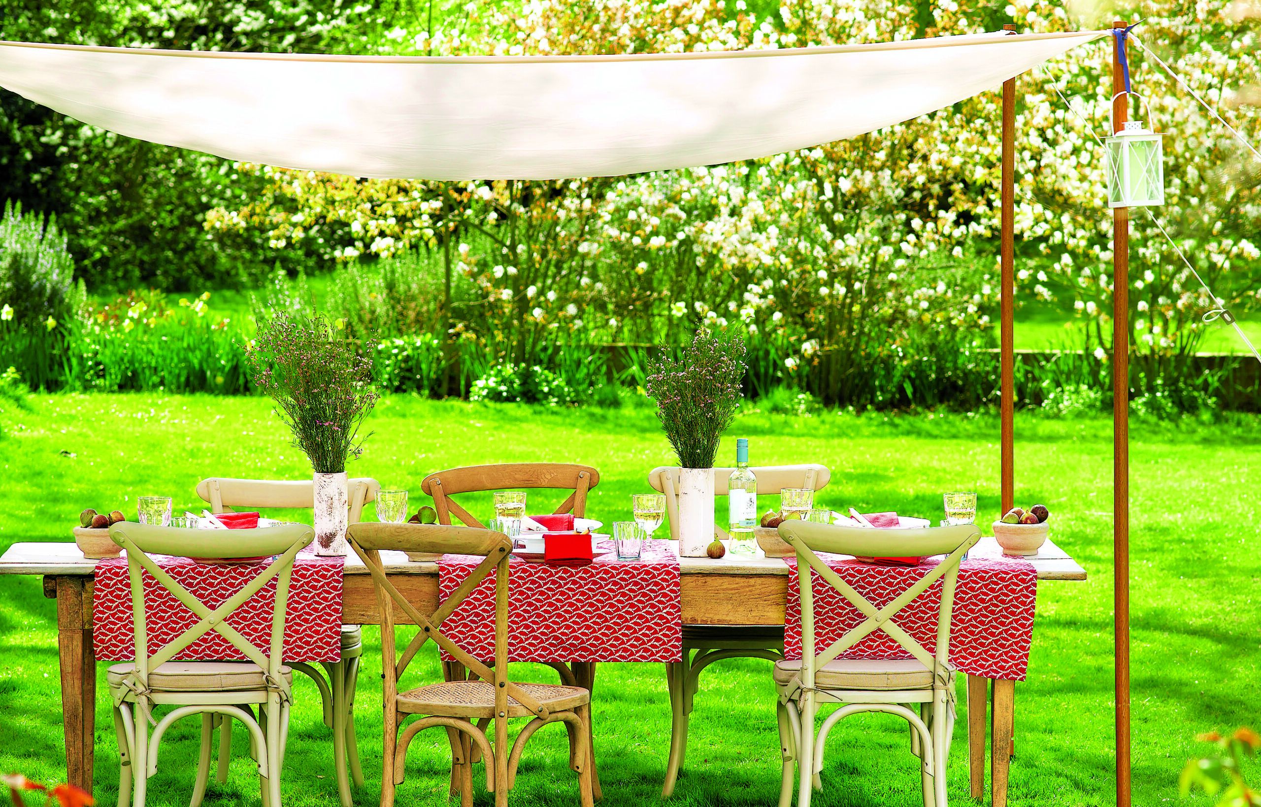 An Outdoor Dining Space with an easy canopy.