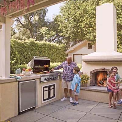 Quality grill and dishwasher built into the the concrete outdoor kitchen set up. 