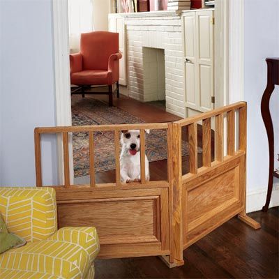 Dog behind a DIY wooden dog gate