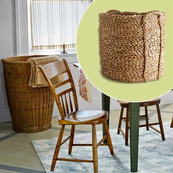 A woven basket sitting against the wall in a dining room.