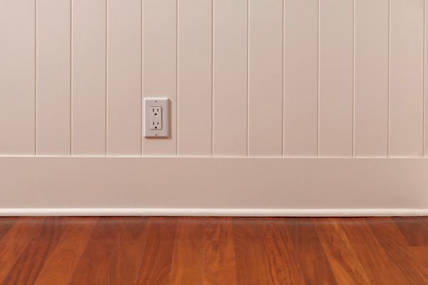 Wood plank wainscoting made from flooring scraps.