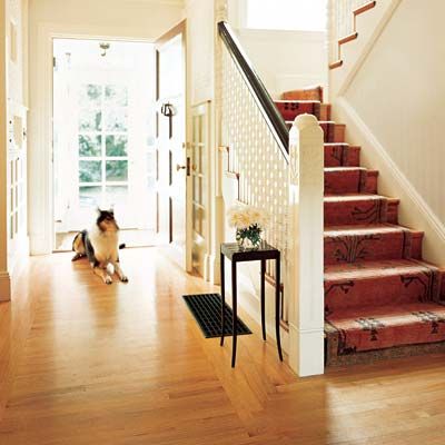 Foyer with oak hardwood flooring.