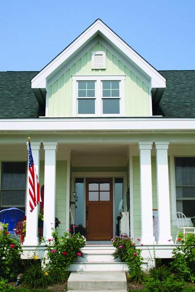 Image of a home with green fiber-cement siding