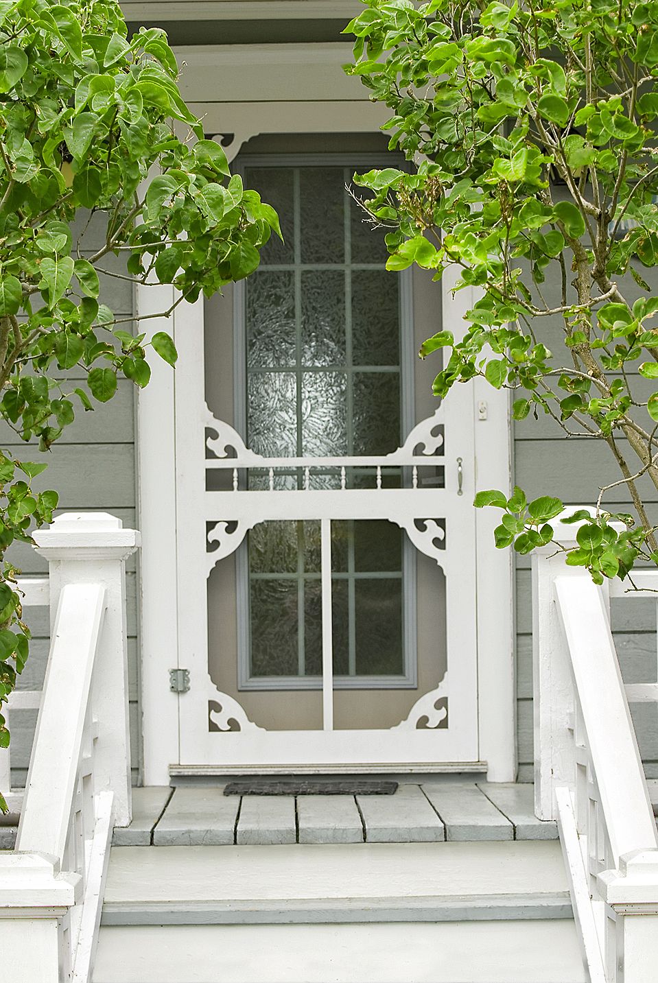 A house with a screen door that gives it vintage charm.