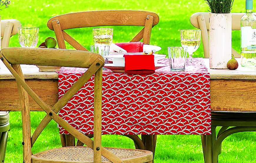 An Outdoor Dining Space with vibrant table runners.