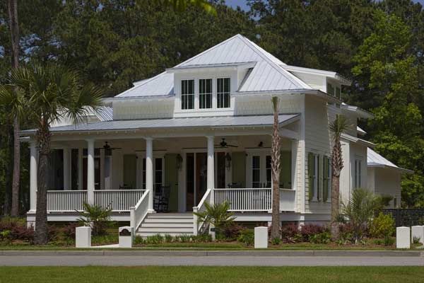 Image of a large home with white fiber-cement siding