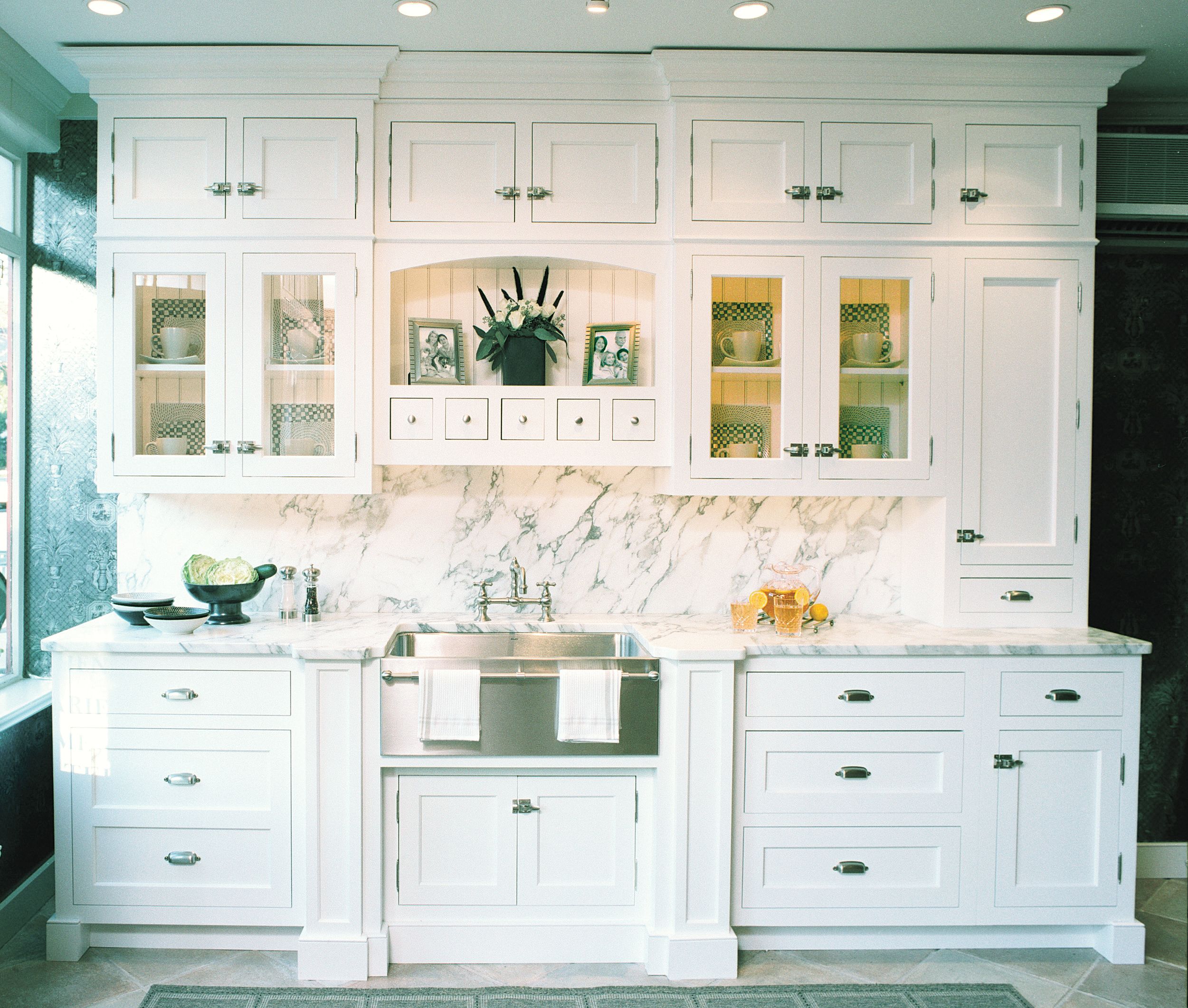 Custom Colonial door in white-painted plywood kitchen cabinet