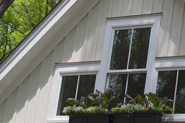 Image of windows on a home surrounded by fiber-cement siding