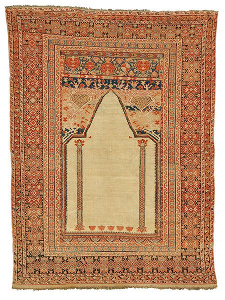 A Ghiordes Prayer Rug from the late 18th-century.