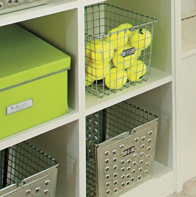 catchall baskets within cubbies in a mudroom