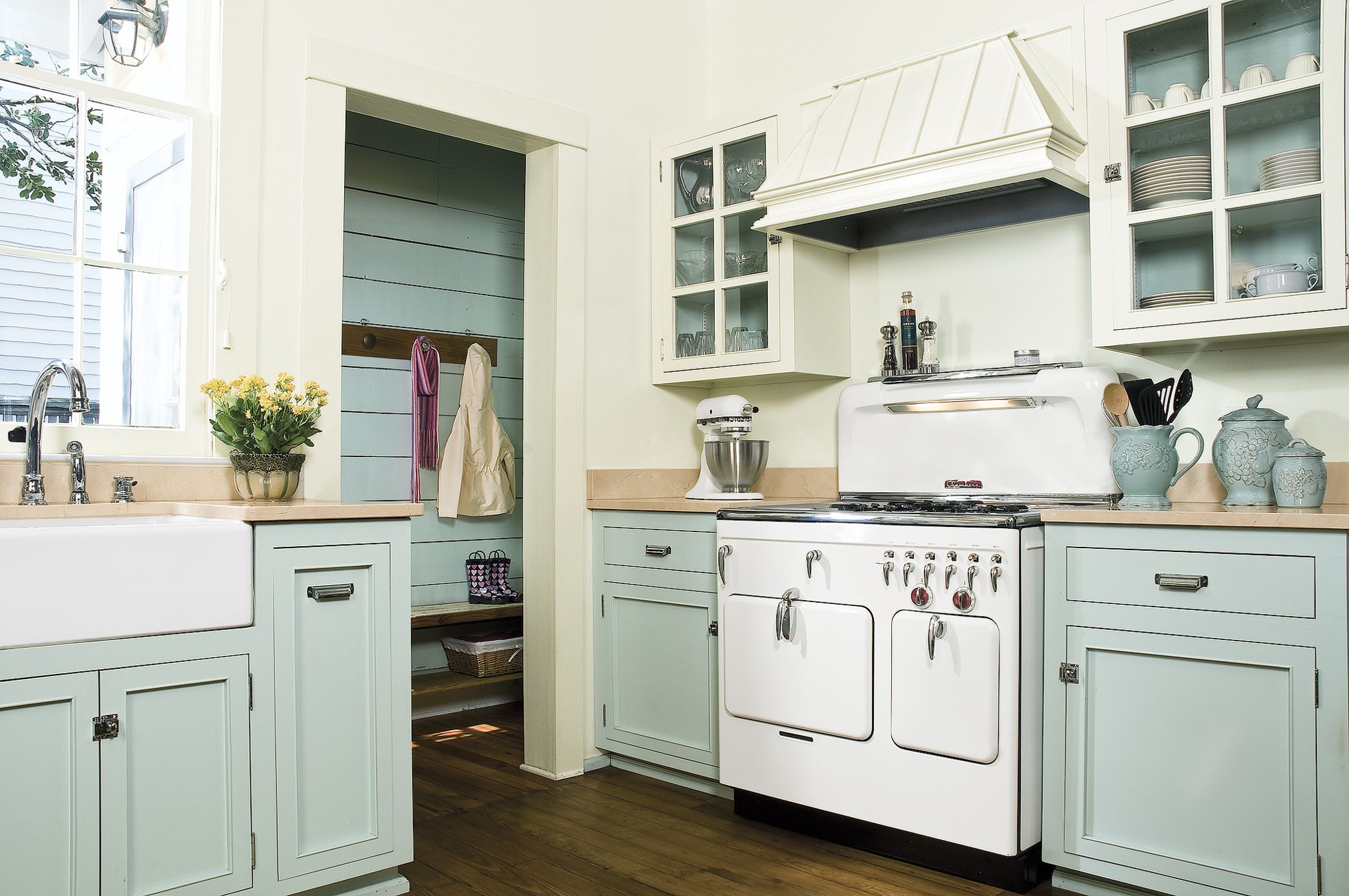 A kitchen with Cabinets painted in a Vintage Two-Tone Scheme.