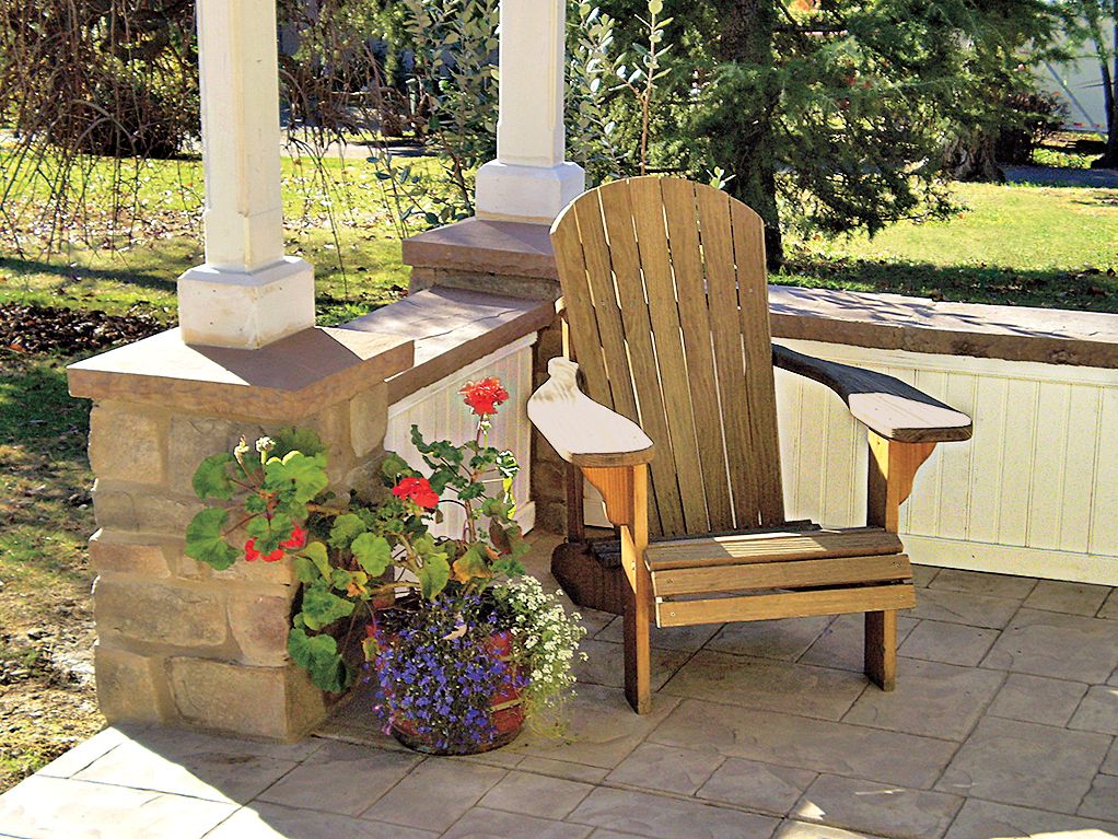 A outdoor patio with a wainscot beadboard.