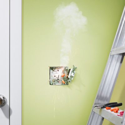 an electrical outlet that is starting to smoke 