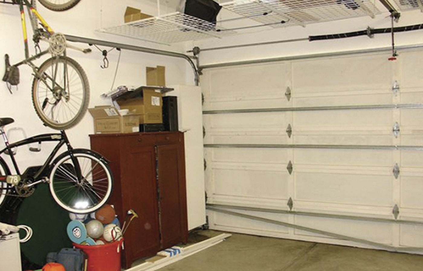 a before picture of a traditional garage before it became a rec room