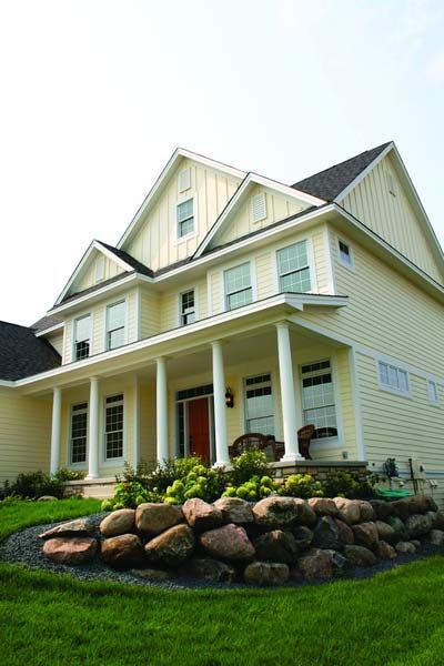 Image of a home with yellow fiber-cement siding