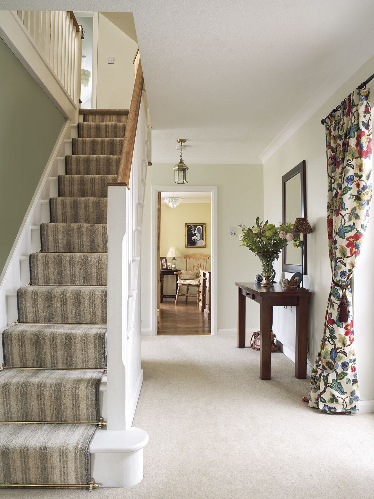 Stairs with a stair runner rod to give them a vintage charm.