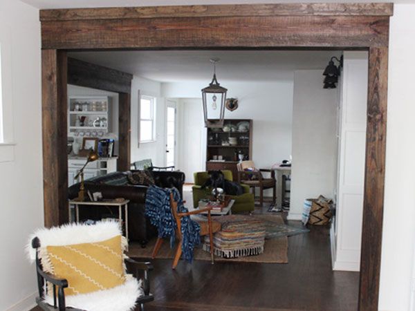 Faux wood beams used with a wood-framed doorway.