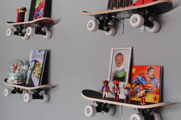 Skateboard shelves on a child's bedroom wall.