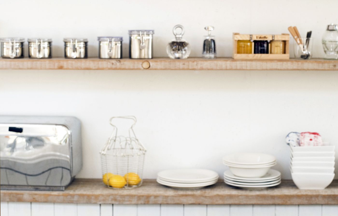 Open kitchen shelving with a cohesive design